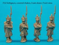 F32 – Four voltigeurs in march-attack poses with covered shakos and coats down