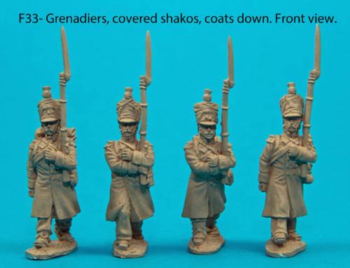 F33 – Four Grenadiers in march-attack poses with covered shakos and coats down